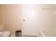 Simple bathroom with a toilet, bathtub and door at 18001 Richmond Place Dr # 1122, Tampa, FL 33647