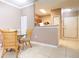 Cozy dining area with glass-top table and wicker chairs at 18001 Richmond Place Dr # 1122, Tampa, FL 33647