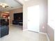 Living room with tile floors and a large TV at 18001 Richmond Place Dr # 1122, Tampa, FL 33647