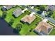 House and backyard near lake from above at 887 Clear Lake Dr, Englewood, FL 34223