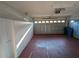 Attached garage with sectional door and storage cabinets at 801 Manchester Woods Dr # 38, Sun City Center, FL 33573