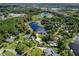 Aerial view highlighting a lakefront home's location in a residential area at 20605 Preston Ln, Lutz, FL 33558