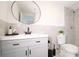 Modern bathroom with gray vanity and walk-in shower at 20605 Preston Ln, Lutz, FL 33558