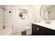 Clean bathroom with a white toilet and dark vanity at 20605 Preston Ln, Lutz, FL 33558