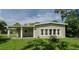 Charming single story home with covered porch and well-manicured lawn at 20605 Preston Ln, Lutz, FL 33558