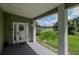 Inviting front entrance with a view of a tranquil lake at 20605 Preston Ln, Lutz, FL 33558