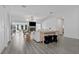 Open living space with light colored furniture and a fireplace at 20605 Preston Ln, Lutz, FL 33558