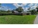 Spacious side yard with partial fence and view of neighboring home at 20605 Preston Ln, Lutz, FL 33558