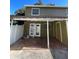 Private back patio with tile flooring and covered area at 7634 Cortez Ct, Tampa, FL 33615