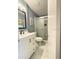 Updated bathroom with modern vanity and shower at 7634 Cortez Ct, Tampa, FL 33615