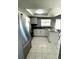 White kitchen cabinets and granite countertops at 7634 Cortez Ct, Tampa, FL 33615