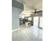 Kitchen features island with seating and access to patio at 7634 Cortez Ct, Tampa, FL 33615