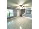 Living room with tile floors and stairs to upper level at 7634 Cortez Ct, Tampa, FL 33615