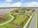 Community dog park with agility equipment and benches at 5472 Summer Sunset Dr, Apollo Beach, FL 33572