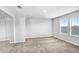 Bright bedroom with neutral walls, carpeted floors, and two windows at 5472 Summer Sunset Dr, Apollo Beach, FL 33572