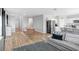 Open concept living room and kitchen with hardwood floors at 5472 Summer Sunset Dr, Apollo Beach, FL 33572