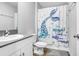 Bathroom with single vanity, toilet, and shower/tub combo at 5472 Summer Sunset Dr, Apollo Beach, FL 33572