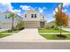 Two-story home with a neutral color palette and a two-car garage at 5472 Summer Sunset Dr, Apollo Beach, FL 33572