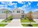 Two-story house with a two-car garage and landscaping at 5472 Summer Sunset Dr, Apollo Beach, FL 33572