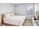 Bright bedroom with a king-size bed and plenty of natural light at 5472 Summer Sunset Dr, Apollo Beach, FL 33572