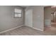 Bedroom with window, closet, and wood-look floors at 8441 55Th N Way, Pinellas Park, FL 33781