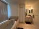 Primary bathroom with a large bathtub and shower at 6114 Nantucket Ln, Spring Hill, FL 34608