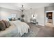 Luxurious main bedroom with king-size bed and ensuite bathroom access at 31417 Sun Kettle Loop, Wesley Chapel, FL 33545