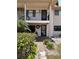 Two-story building exterior with walkway, landscaping, and building number 2 at 9920 Eagles Point Cir # 2, Port Richey, FL 34668