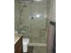Bathroom with walk-in shower and built-in seat at 9920 Eagles Point Cir # 2, Port Richey, FL 34668