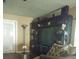 Living room with entertainment center and floor lamp at 9920 Eagles Point Cir # 2, Port Richey, FL 34668