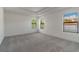 Spacious bedroom with a tray ceiling, recessed lighting, and natural light from the windows at 3204 N Morgan St, Tampa, FL 33603