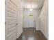 Inviting entryway with stylish door, modern lighting, and hardwood floors creating a warm ambiance at 3204 N Morgan St, Tampa, FL 33603
