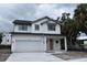 Charming new construction home with two stories, a garage, and a covered front porch at 3204 N Morgan St, Tampa, FL 33603