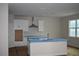 Modern kitchen featuring an island, sleek appliances, and ample cabinet space for storage at 3204 N Morgan St, Tampa, FL 33603