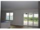 Open living area with sliding glass doors and natural light to seamlessly blend indoor and outdoor living at 3204 N Morgan St, Tampa, FL 33603