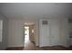 Bright living room featuring sleek doors, neutral walls, and a welcoming entrance at 3204 N Morgan St, Tampa, FL 33603