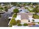 Aerial view of waterfront property with private dock at 8716 Elmwood Ln, Tampa, FL 33615