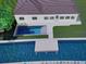 Aerial view of house, pool, and dock on canal at 8716 Elmwood Ln, Tampa, FL 33615