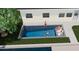 Gathering enjoying a modern rectangular pool at 8716 Elmwood Ln, Tampa, FL 33615