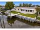 Aerial view of waterfront home with private dock at 8716 Elmwood Ln, Tampa, FL 33615