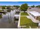 Aerial view showcasing home, dock and canal views at 8716 Elmwood Ln, Tampa, FL 33615