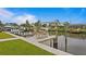 Private boat dock with seating area and lift at 8716 Elmwood Ln, Tampa, FL 33615