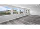Spacious Gathering room with water views and wood-look flooring at 8716 Elmwood Ln, Tampa, FL 33615