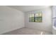 Well-lit bedroom featuring window blinds and carpeted floor at 3204 N Morgan St, Tampa, FL 33603