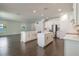 Open kitchen with two islands, stainless steel appliances, and hardwood floors at 3204 N Morgan St, Tampa, FL 33603