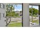 Private balcony overlooking the tree-lined street at 210 E Janette Ave, Tampa, FL 33603