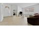 Open living area with a view of the home's entryway at 19148 Dove Creek Dr, Tampa, FL 33647