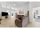 Living room with brown couches and a built-in fireplace at 19148 Dove Creek Dr, Tampa, FL 33647