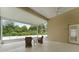 Relaxing screened porch overlooking a wooded area at 19148 Dove Creek Dr, Tampa, FL 33647