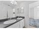 Clean bathroom with double vanity and view of another room at 19148 Dove Creek Dr, Tampa, FL 33647
